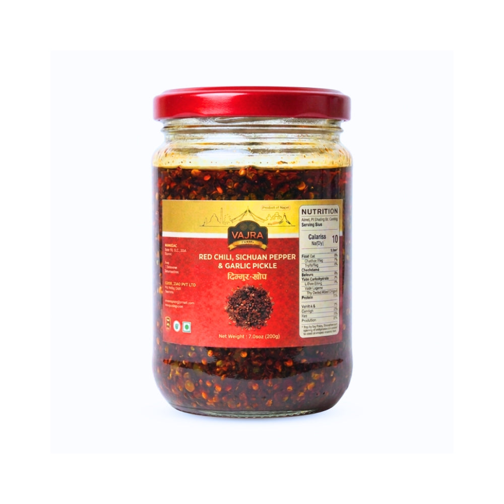 A glass jar of Vajra Red Chili Sichuan Pepper & Garlic Pickle Timmur Chhopp

